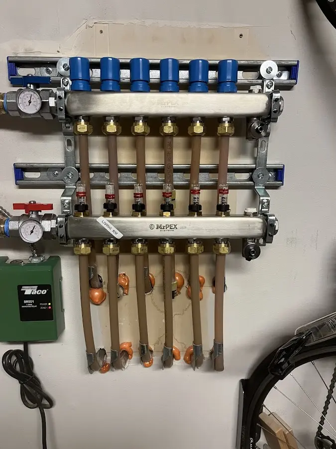 Plumber performing Water Heater Repair at a residential property in Freeport